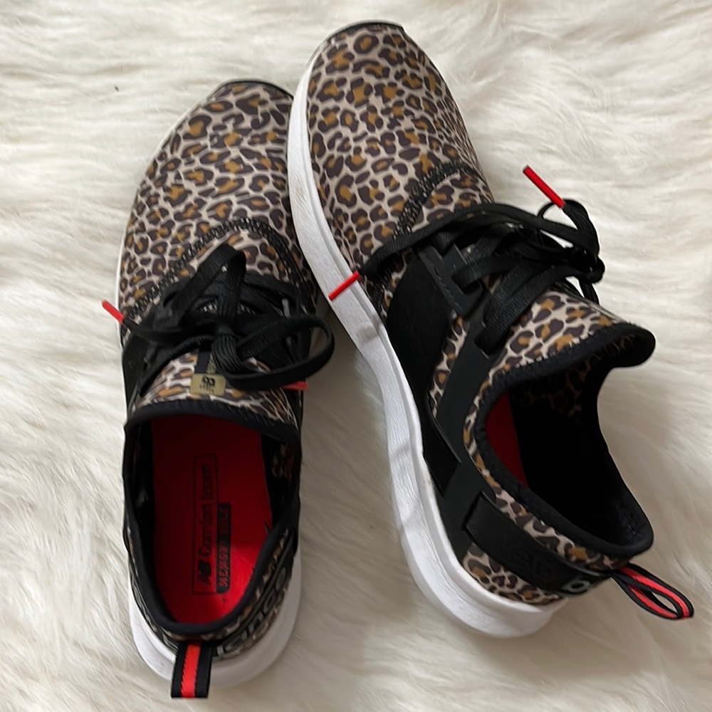 Leopard print new balance tennis shoes.